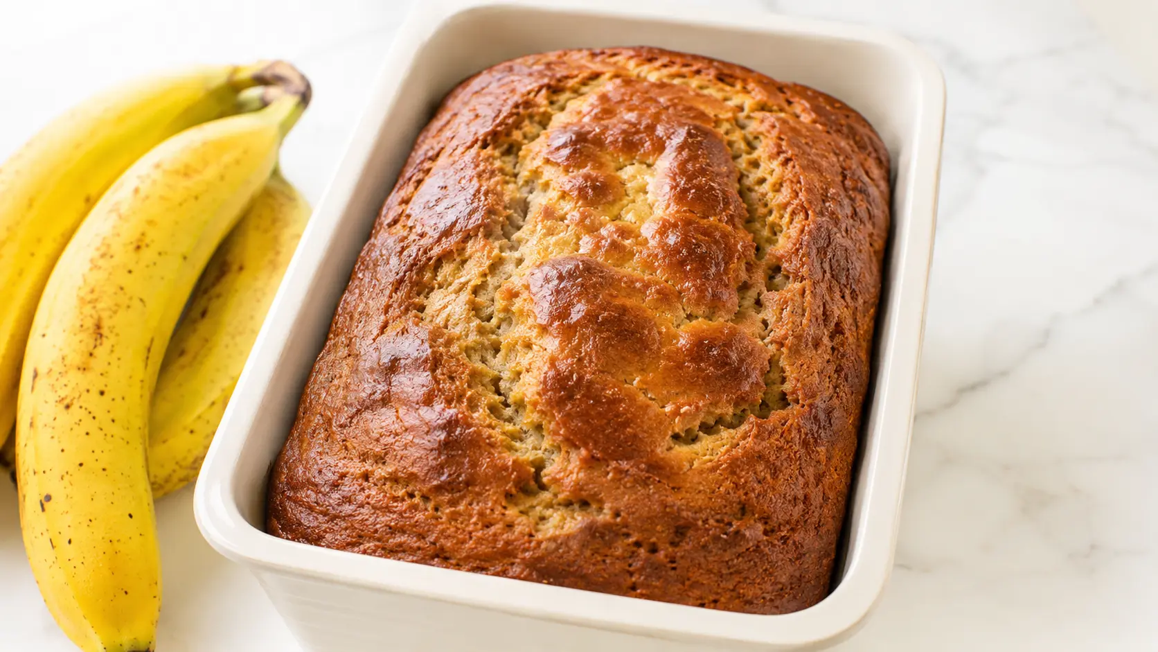 Almond Flour Banana Bread sliced on a rustic board